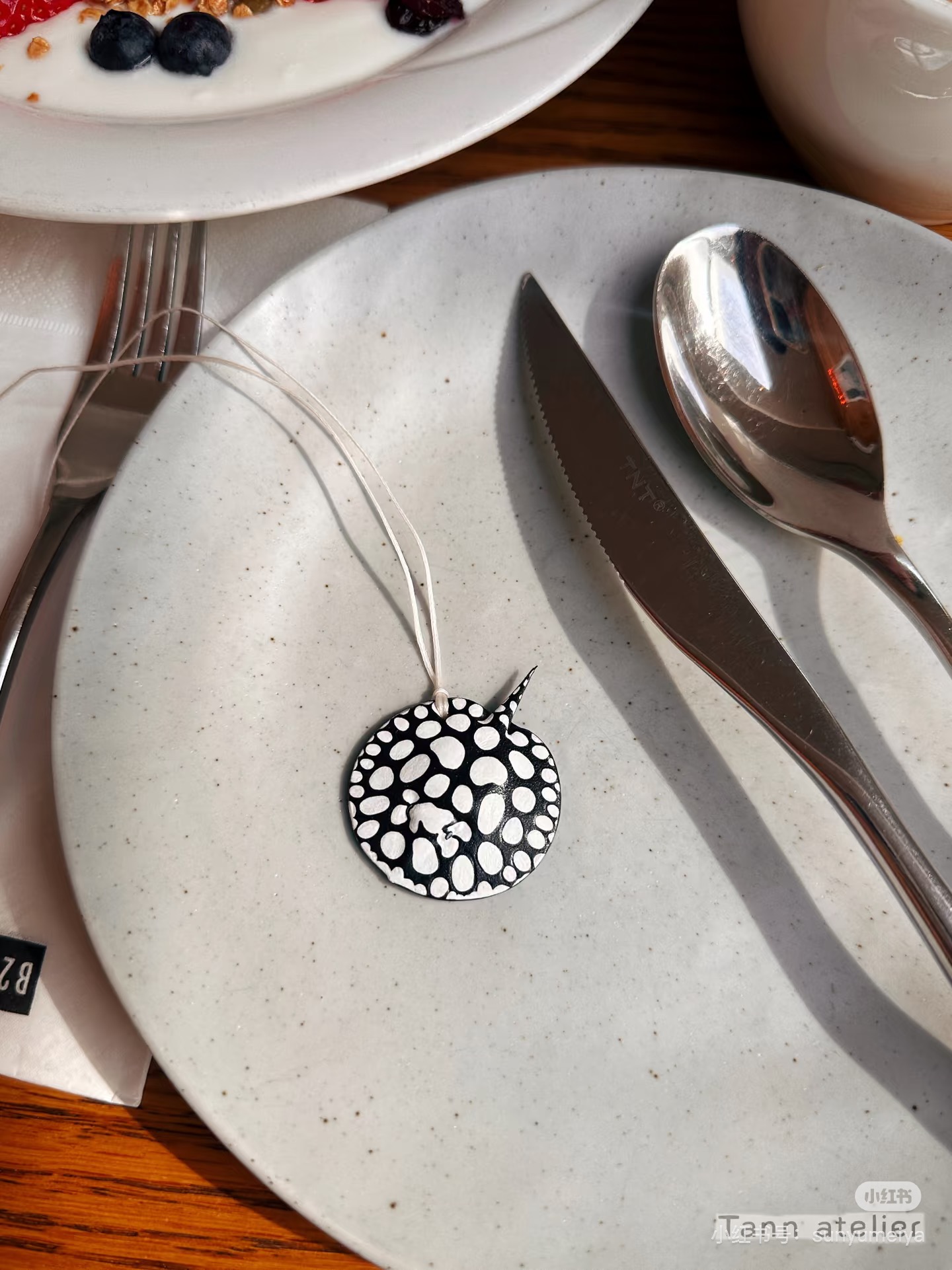 Black and white spotted eagle ray leather charm